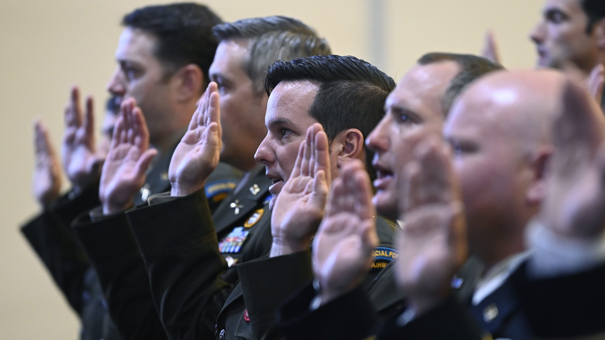 Warrant Officers from the U.S. Army John F. Kennedy Special Warfare Center and School take an oath of commission during the Special Forces Warrant Officer Technical and Tactical Certification Appointment and Graduation Ceremony at Fort Bragg, North Carolina May 11, 2023. Soldiers who attended the course were educated, tranined and certified for MOS 180A in operational and tactical requirements for planning and executing special operations worldwide and to serve as Assistant Detachment Commanders for a SFOD-A. (U.S. Army photo by K. Kassens)
