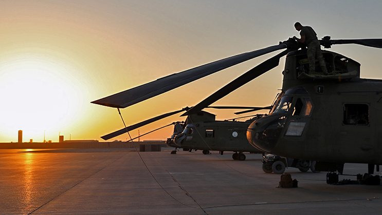 U.S. Army Soldiers assigned to the 3rd General Support Aviation Battalion, 126th Aviation Regiment (3-126 GSAB), Massachusetts Army National Guard (MAARNG), conduct preflight checks and load cargo onto CH-47 Chinooks August 27, 2023, at Al Asad Air Base, Iraq. The 3-126 GSAB is deployed to support operations in the U.S. Central Command area of responsibility. While headquartered in the MAARNG, the unit comprises multiple states’ Army National Guard units, including New York, Maryland, Vermont, and Connecticut. (U.S. Army National Guard photo by Sgt. 1st Class Shane Hamann)