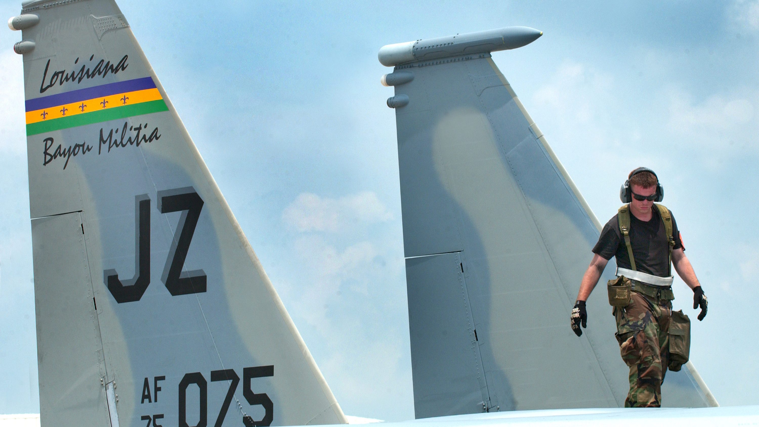 A Louisiana Air National Guardsman of the 159th Fighter Wing Maintenance Group inspects the fuselage of a F-15 Eagle aircraft during an operational readiness exercise at the Air National Guard Combat Readiness Training Center in Gulfport, Miss., on Aug. 12, 2005. (DoD photo by Master Sgt. Daniel P. Farrell, U.S. Air Force. (Released))