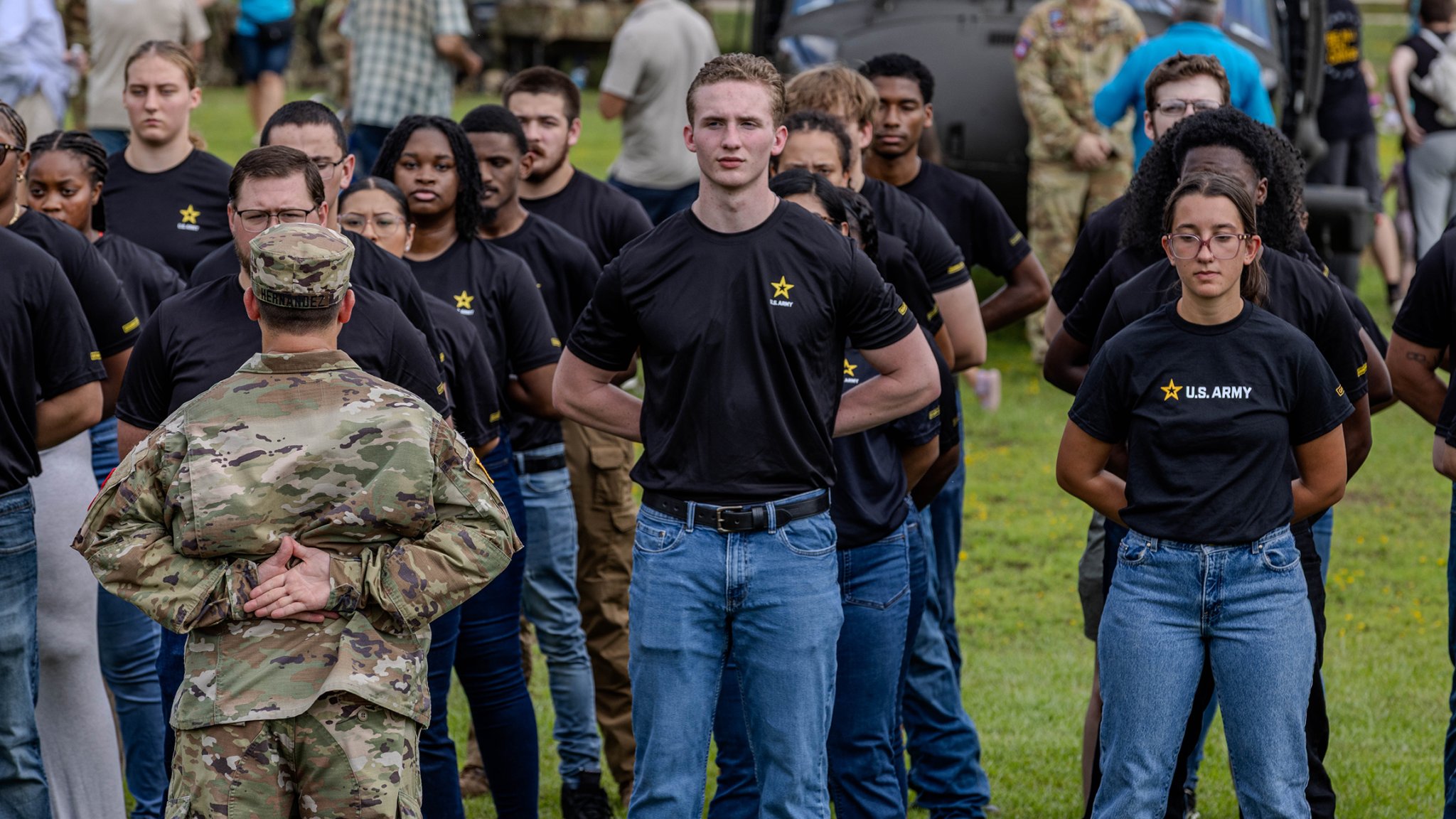 Event attendees prepare to take the oath of enlistment during the 85th National Airborne Day celebration at the Airborne and Special Operations Museum, Fayetteville, N.C., Aug. 16, 2025. This event commemorated paratroopers past and present, celebrating 85 years of U.S. airborne history with events at the Airborne and Special Operations Museum (ASOM). (U.S. Army photo by Spc. Richard Morgan)