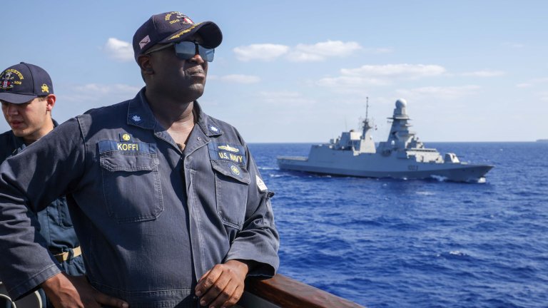 U.S. Navy Cmdr. James Koffi, commanding officer of Arleigh Burke-class guided-missile destroyer USS Truxtun (DDG 103) scans the sea as USS Truxtun passes the Carlo Bergamini-class frigate ITS Virginio Fasan (F 591), during a replenishment-at-sea exercise for Exercise BRIGHT STAR 25, Sept. 8, 2025. Exercise BRIGHT STAR 25 is a multilateral U.S. Central Command (USCENTCOM) command-post exercise, field training exercise and senior leader seminar, held in the Arab Republic of Egypt along with other partner nations. Participation strengthens military-to-military relationships between U.S. forces and our Egyptian partners in the USCENTCOM area of responsibility, as well as other participating nations. The exercise enhances regional security and stability by responding to modern-day security scenarios. (U.S Navy Video by Mass Communication Specialist Seaman Sierra Bryant)