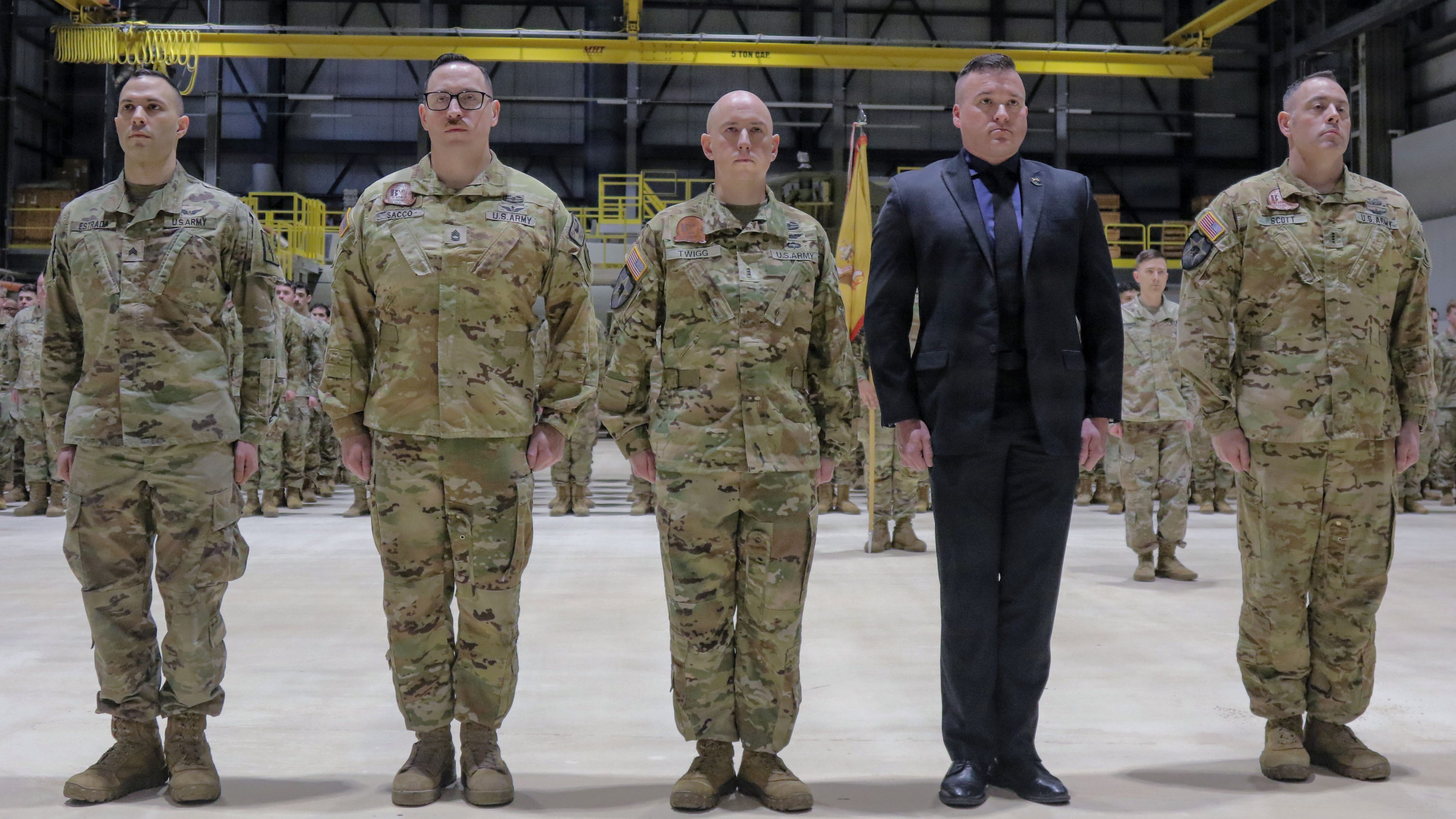 Five of six New York Army National Guard Soldiers who received French medal in recognition of the aid they offered to French special operations forces in August 2023, stand in formation during an award ceremony in Rochester, New York, Feb. 22, 2026. The Soldiers were awarded the French National Defense Gold Medal with Bronze Star by Maj. Gen. Michel Natali, the assistant adjutant general for Army. Pictured are, from left, Staff Sgt. Jedediah Estrada, Staff Sgt. Samuel Sacco, Chief Warrant Officer 2 Jared Twigg, Retired Chief Warrant Officer 3 Aaron Taylor, and Chief Warrant Officer 4 Christopher Scott. Not pictured is Sgt. Zachary Albright who was attending a school. (U.S. Army photo by Sgt. Jean Sanon)