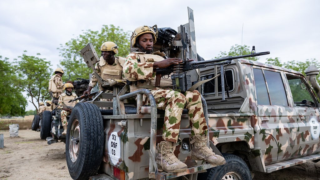 A Nigerian soldier from the Multinational Joint Task Force (MNJTF) loads his machine gun during training at the MNJTF military base, Sector 3 Headquarters, in Monguno, Borno state, Nigeria, on July 5, 2025. Twelve checkpoints manned by the Nigerian army control the various entrances to Monguno. Monguno's huge fortifications have kept the garrison town mostly secure even as northeastern Nigeria has seen a recent surge in attacks on military bases by jihadists fighting a grinding 16 year war. Fighting in Borno may have eased since the conflict's highpoint in 2015 as jihadists have been forced back. But militants from Islamic State West Africa Province or rival Boko Haram have attacked or temporarily overrun a dozen military bases since the start of the year. (Photo by Joris Bolomey / AFP) (Photo by JORIS BOLOMEY/AFP via Getty Images)