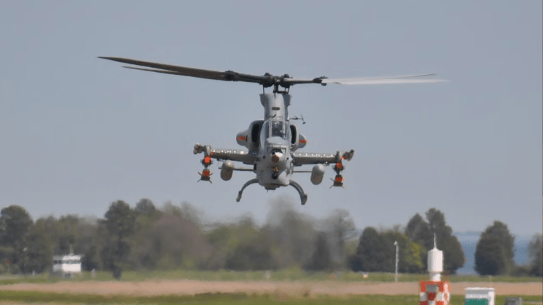 Marine AH-1Z Viper helicopter armed with Red Wolf launched effects.