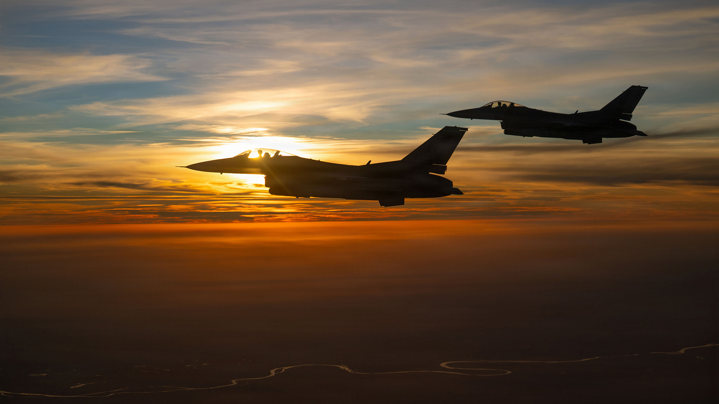Two U.S. Air Force F-16 Fighting Falcon aircraft fly alongside a KC-135 Stratotanker aircraft over the U.S. Central Command area of responsibility, Dec. 30, 2025. The F-16 played a key role in executing airpower missions, deterring aggression, and participating in broader security across the CENTCOM AOR. (U.S. Air Force photo by Tech. Sgt. Nicholas Monteleone)