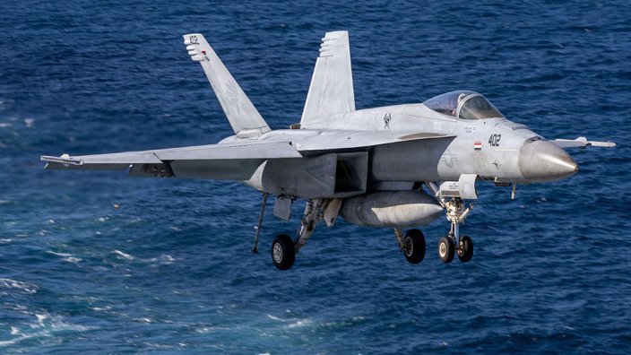 An F/A-18E Super Hornet aircraft, attached to Strike Fighter Squadron 87, lands on the flight deck of the world’s largest aircraft carrier, Ford-class aircraft carrier USS Gerald R. Ford (CVN 78), while underway in the Caribbean Sea, Dec. 11, 2025. U.S. military forces are deployed to the U.S. Southern Command area of responsibility in support of the U.S. Southern Command mission, Department of War-directed operations, and the president's priorities to disrupt illicit drug trafficking and protect the homeland. (U.S. Navy photo)