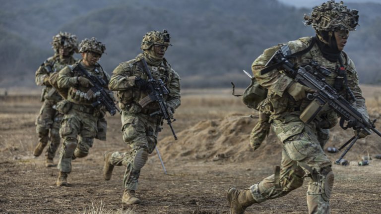 Soldiers assigned to Charlie Company, 2-23 Infantry Regiment, 1st Stryker Brigade Combat Team, conduct a Combined Arms Live-Fire Exercise, honing their combat skills through realistic training scenarios
