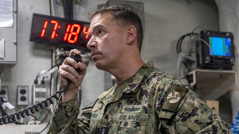 U.S. Navy Adm. Brad Cooper, commander of U.S. Central Command, makes an announcement aboard Nimitz-class aircraft carrier USS Abraham Lincoln (CVN 72) in the Arabian Sea, Feb. 7, 2026. Abraham Lincoln is deployed to the U.S. 5th Fleet area of operations to support maritime security and stability in the Middle East. (U.S. Navy photo by Mass Communication Specialist 2nd Class Sonny Escalante)