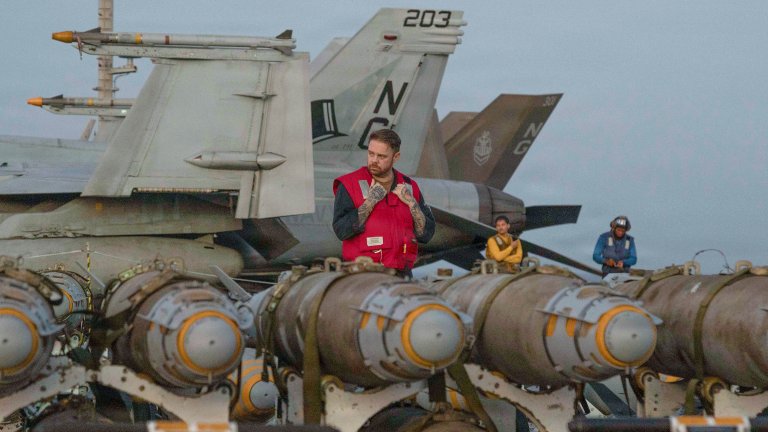 U.S. Sailors transfer ordnance on the flight deck of Nimitz-class aircraft carrier USS Abraham Lincoln (CVN 72), in the Arabian Sea, Feb. 27, 2026.