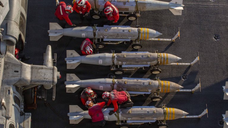 U.S. Sailors prepare to stage ordnance on the flight deck of Nimitz-class aircraft carrier USS Abraham Lincoln (CVN 72) in support of Operation Epic Fury, Feb. 28, 2026. (U.S. Navy photo)
