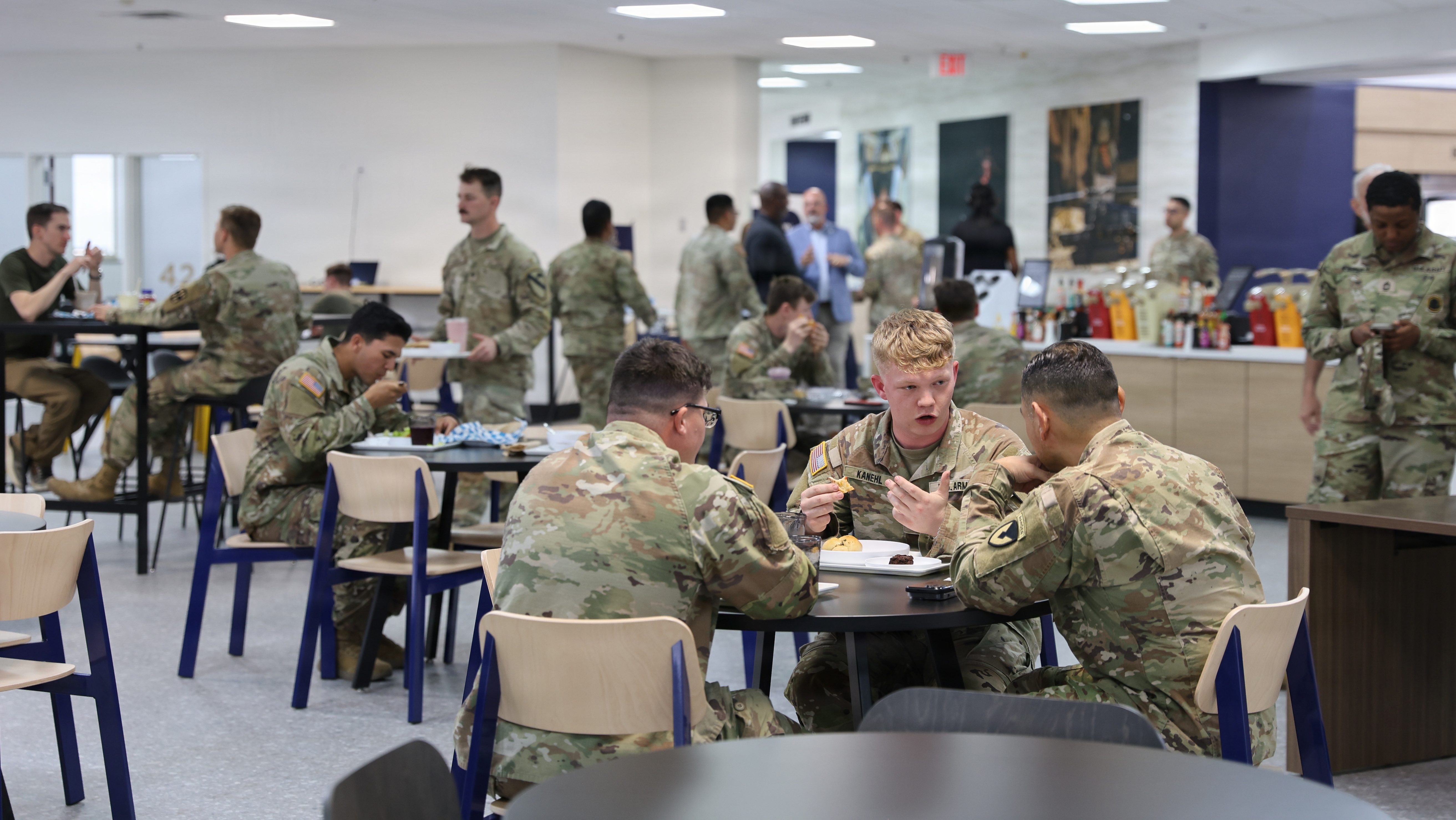 Soldiers sit and eat together at 42 Bistro, the Army's first Campus-Style Dining Venue on Fort Hood, Texas. The CSDV pilot transforms the way the Army fuels its soldiers by leveraging industry experts’ experience to operate restaurants on installations that offer more food options, better service, ambiance and hours.
