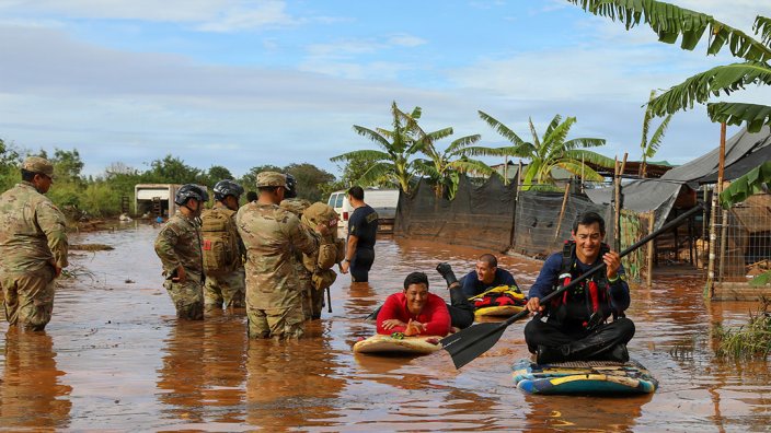 U.S. Soldiers assigned to the Hawaii National Guard Chemical, Biological, Radiological, Nuclear, and Explosives Enhanced Response Force Package assist the City and County of Honolulu first responders in search and recovery efforts during flood impacted zones in Waialua, Hawaii, March 21, 2026. Gov. Josh Green activated the Hawaii National Guard to assist in recovery efforts following record rainfall and flash flooding caused by a Kona Low weather system. (U.S. National Guard photo by Spc. Daniel Barcenas)