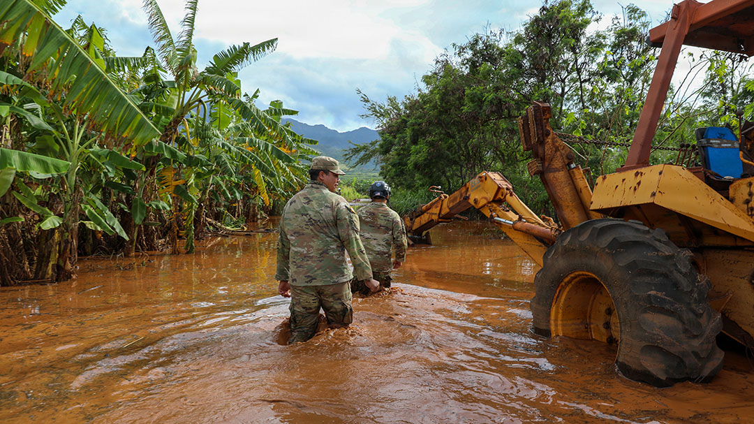 U.S. Soldiers assigned to the Hawaii National Guard Chemical, Biological, Radiological, Nuclear, and Explosives Enhanced Response Force Package assist the City and County of Honolulu first responders in search and recovery efforts during flood impacted zones in Waialua, Hawaii, March 21, 2026. Gov. Josh Green activated the Hawaii National Guard to assist in recovery efforts following record rainfall and flash flooding caused by a Kona Low weather system. (U.S. National Guard photo by Spc. Daniel Barcenas)
