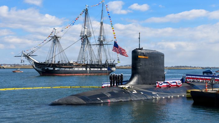 Image: The USS Constitution sails past the Virginia-class nuclear-powered fast-attack submarine USS Massachusetts (SSN 798) during Massachusetts’ commissioning in Boston, on March 28th, 2026. Massachusetts is the newest fast-attack submarine and the fifth U.S. Navy vessel to bear the name. (U.S. Navy photo by Mass Communication Specialist 2nd Class Lucas J. Hastings) 