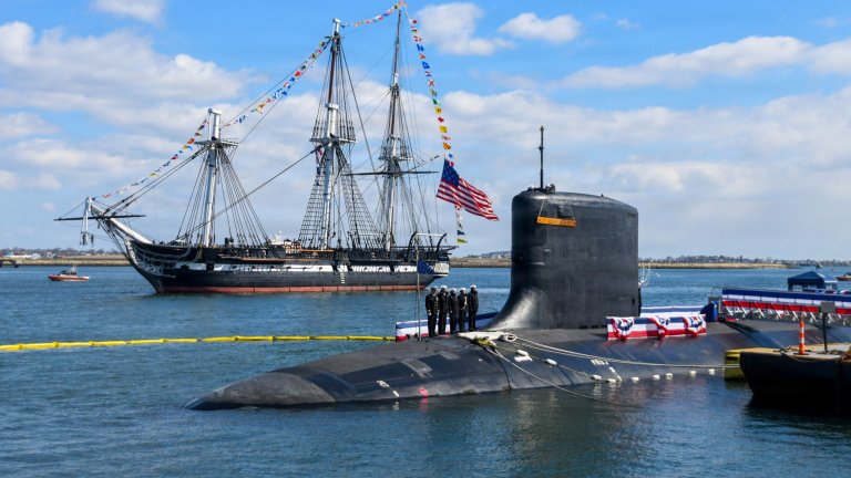 Image: The USS Constitution sails past the Virginia-class nuclear-powered fast-attack submarine USS Massachusetts (SSN 798) during Massachusetts’ commissioning in Boston, on March 28th, 2026. Massachusetts is the newest fast-attack submarine and the fifth U.S. Navy vessel to bear the name. (U.S. Navy photo by Mass Communication Specialist 2nd Class Lucas J. Hastings) 
