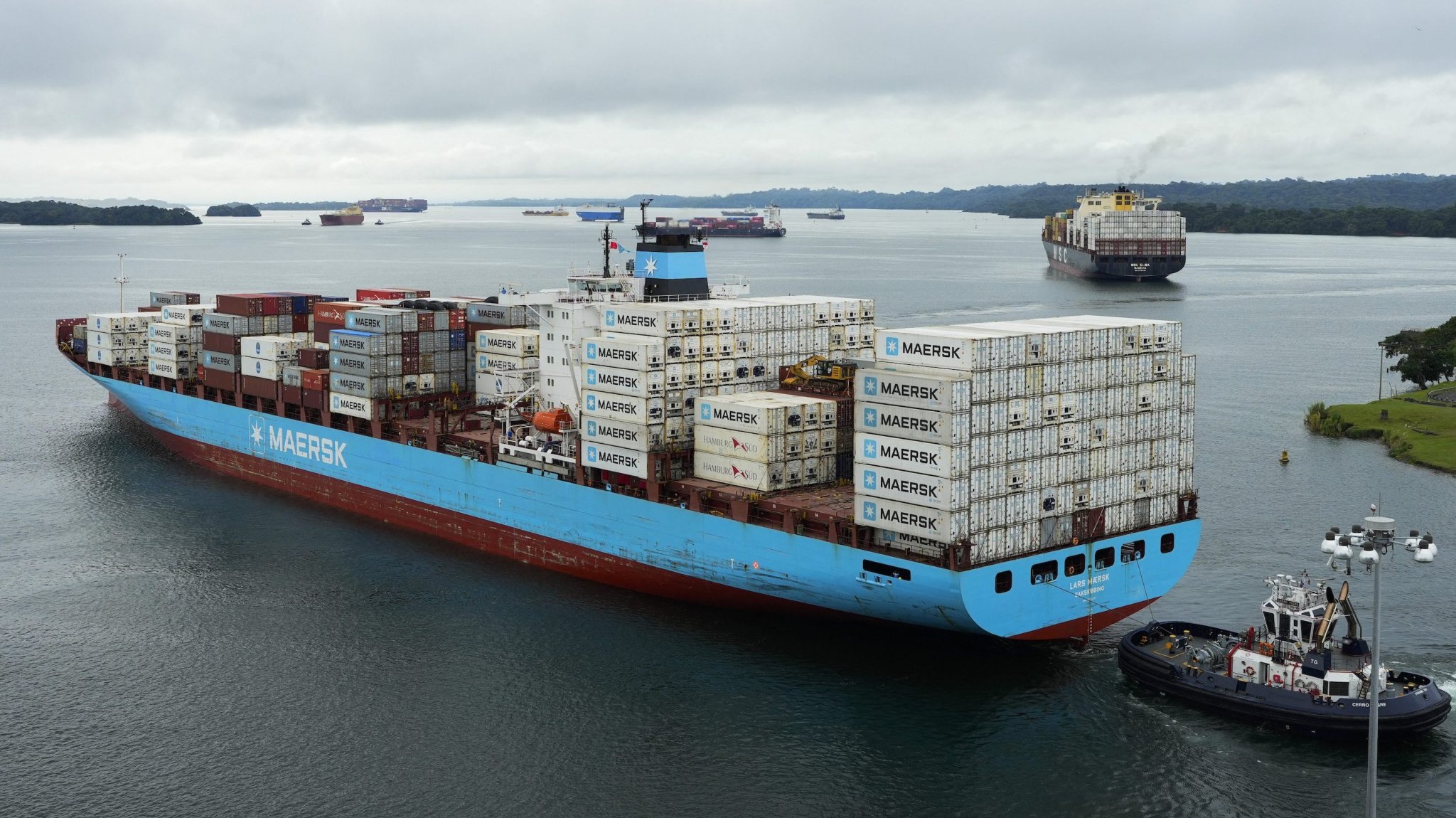 The Danish cargo ship Lars Maersk sails on Gatun Lake near the Agua Clara Locks of the Panama Canal in Colon City, Panama, on December 28, 2024. On 31 December 2024, Panama will celebrate the 25th anniversary of sovereignty over the Canal. (Photo by ARNULFO FRANCO / AFP)