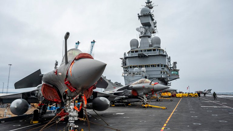 A picture taken on February 25, 2026, shows Rafale M (Marine) fighter jets parked on the flight deck with the conning tower in the background as the French aircraft carrier Charles De Gaulle during a media tour while moored at the quay of the North Port in Malmo, Sweden. (Photo by Johan NILSSON / TT NEWS AGENCY / AFP via Getty Images) / Sweden OUT