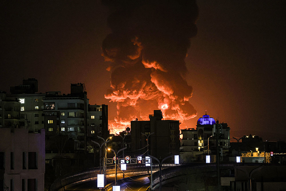 TEHRAN, IRAN - MARCH 07: A large plume of smoke rises over Tehran after explosions were reported in the city during the night on March 07, 2026 in Tehran, Iran. (Photo by Contributor/Getty Images)