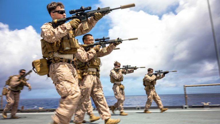 U.S. Marines with Battalion Landing Team 3/5, 11th Marine Expeditionary Unit, conduct reloading drills with M27 infantry automatic rifles as part of weapons manipulation training aboard Whidbey Island-class dock landing ship USS Comstock (LSD 45), in the Pacific Ocean, April 14, 2026. The 11th MEU, embarked aboard the Boxer Amphibious Ready Group, is a persistent, combat credible force contributing to deterrence and crisis response in the U.S. 7th Fleet area of operations. U.S. 7th Fleet, the U.S. Navy's largest forward-deployed numbered fleet, routinely interacts and operates with allies and partners to preserve a free and open Indo-Pacific. (U.S. Marine Corps photo by Sgt. Trent A. Henry)