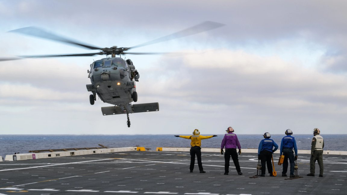 U.S. Navy MH-60 Seahawks from Helicopter Sea Combat Squadron (HSC) 23 are seen arriving on the flight deck of USS John P. Murtha as they prepare to conduct air operations training as NASA, U.S. Navy, and U.S. Air Force teams prepare for the the return of the Artemis II crewmembers to Earth, Monday, April 6, 2026, in the Pacific Ocean off the coast of California. NASA’s Artemis II mission is taking NASA astronauts Reid Wiseman, commander; Victor Glover, pilot; Christina Koch, mission specialist; and CSA (Canadian Space Agency) astronaut Jeremy Hansen, mission specialist on a 10-day journey around the Moon and back aboard their Orion spacecraft. Wiseman, Glover, Koch, and Hansen are scheduled to splash down off the coast of San Diego at approximately 5:07 p.m. PDT (8:07 p.m. EDT) on Friday, April 10.