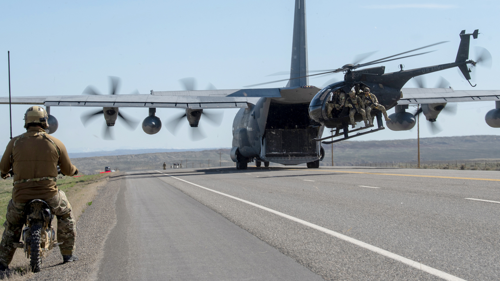 Airmen from the Kentucky Air National Guard’s 123rd Special Tactics Squadron prepare to conduct combat search-and-rescue from an MH-6M Little Bird that was offloaded from a MC-130J Commando II during Exercise Agile Chariot near Riverton, Wyoming, May 2, 2023. Agile Chariot tested Agile Combat Employment capabilities, including using smaller, more dispersed locations and teams to rapidly move and support aircraft, pilots and other personnel wherever they’re needed. (U.S. Air National Guard photo by Master Sgt. Phil Speck)