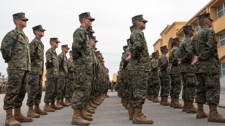 New U.S. Marines with Lima Company, 3rd Recruit Training Battalion, stand in formation before their family day ceremony at Marine Corps Recruit Depot San Diego, California, Jan. 16, 2025. After a long, 13 weeks of physical and mental challenges, early mornings, letters to and from home, this is the first time friends and families will see their newly transformed Marines. (U.S. Marine Corps photo by Cpl. Sarah M. Grawcock)