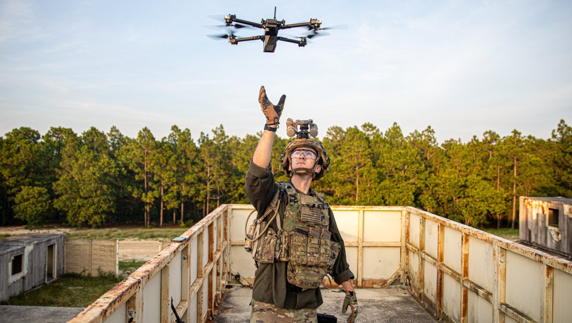 A Paratrooper playing the Opposing Force assigned to 1st Battalion, 505th Parachute Infantry Regiment, 3rd Brigade Combat Team, 82nd Airborne Division, receives a drone during Devil Avalanche, at Fort Bragg, North Carolina, July 22, 2025. Devil Avalanche is a field training exercise where Paratroopers train to operate in periods of darkness, build proficiency on key weapon systems, and sustain the force throughout the exercise. (U.S. Army B-Roll package by Sgt. Dominick Smith)