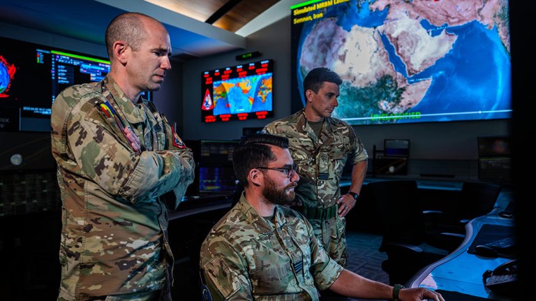 Joint and combined personnel monitor workstations in the Combined Space Operations Center (CSpOC) at Vandenberg Space Force Base, Calif. The center operates 24 hours a day, seven days a week; continuously coordinating, planning, integrating, synchronizing and executing space operations; providing tailored space effects on demand to support combatant commanders; and accomplishing national security objectives. (Composited images are used over the monitors for operational security.)