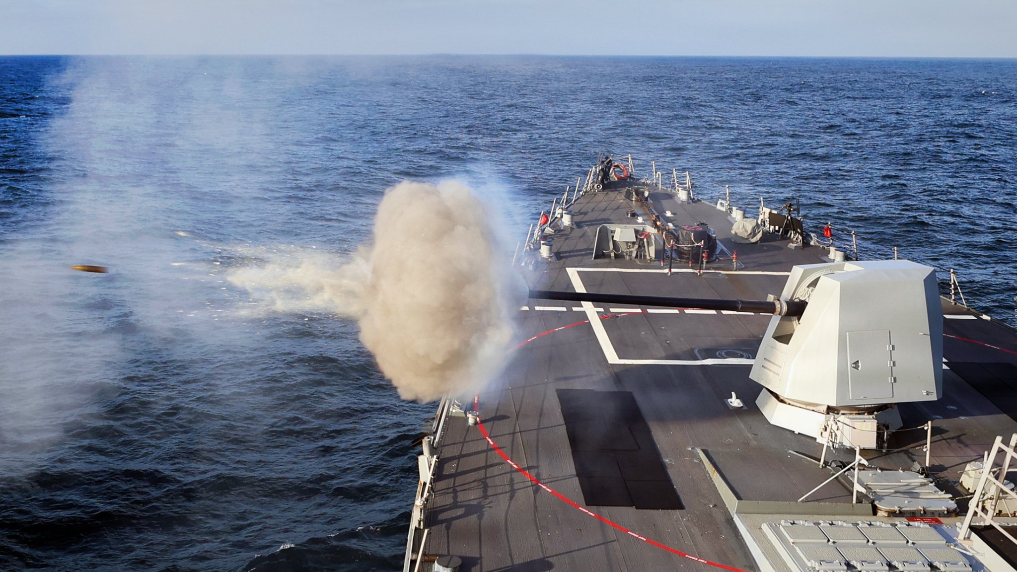 251204-N-JM579-1198 ATLANTIC OCEAN (Dec. 4, 2025) The Arleigh Burke-class guided-missile destroyer USS Paul Ignatius (DDG 117) fires the Mk 45 5 inch gun during a Naval Surface Firing Support (NSFS) exercise, Dec. 4, 2025. Paul Ignatius is on a scheduled deployment in the U.S. 6th Fleet area of operations to support the warfighting effectiveness, lethality and readiness of U.S. Naval Forces Europe-Africa, and defend U.S., Allied and partner interests in the region. (U.S. Navy photo by Mass Communication Specialist 2nd Class Joseph Macklin)