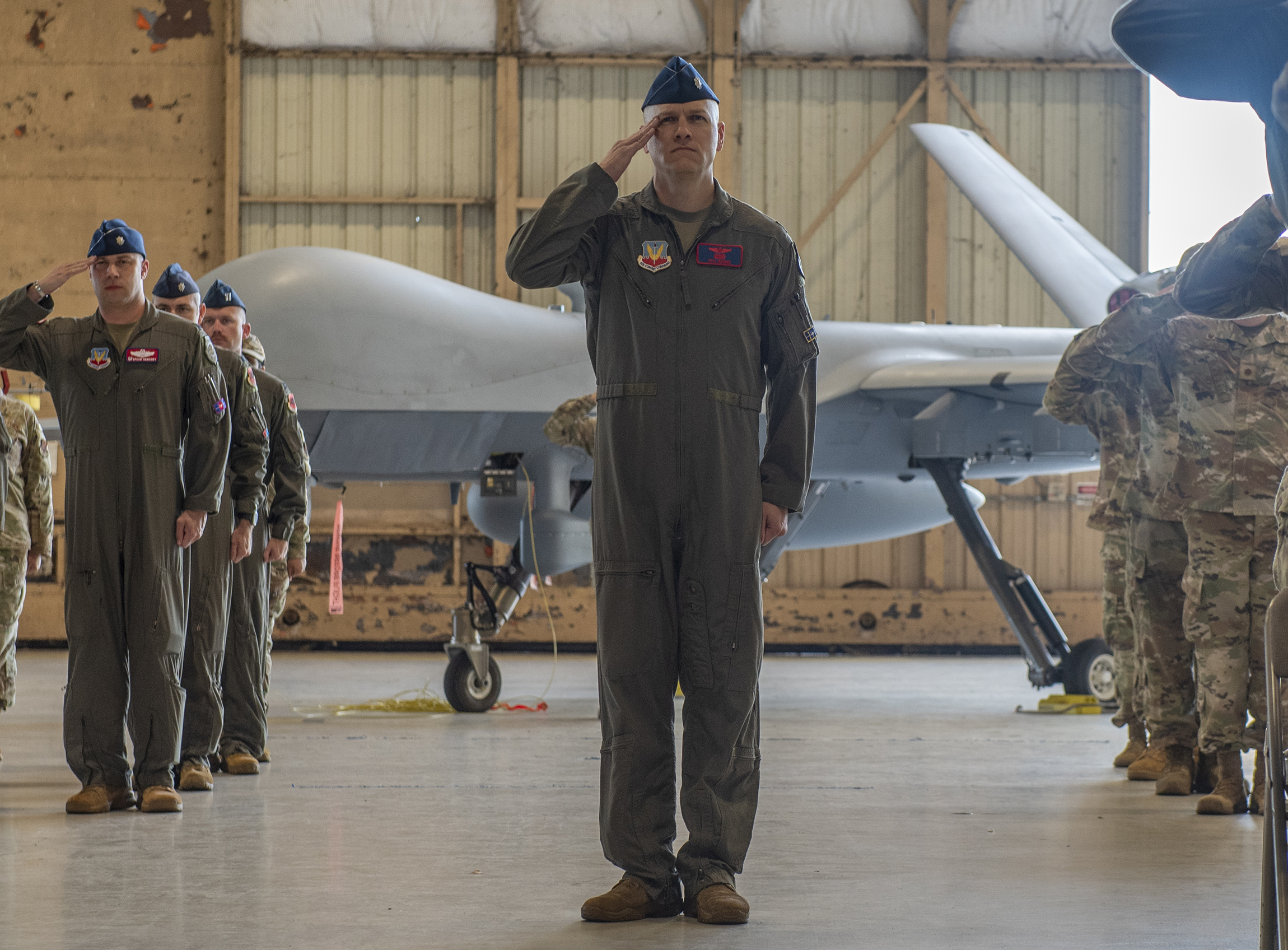 Members assigned to the new 25th Attack Wing render their first salute during a wing redesignation ceremony at Shaw Air Force Base, South Carolina, Sept. 18, 2025. The 25th ATKW, previously the 25th Attack Group, operates globally 24/7/365, supporting four different combatant commands with the MQ-9 Reaper, a Remotely Piloted Aircraft capable of intelligence, surveillance and reconnaissance as well as precision strike. (U.S. Air Force photo by Senior Airman Kylie Barrow)