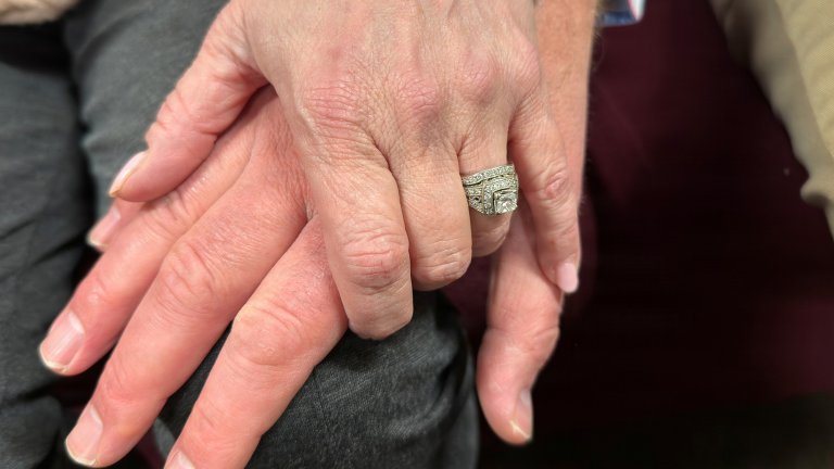 Two married individuals hold hands at Fort Knox, Kentucky on Feb. 24, 2026.