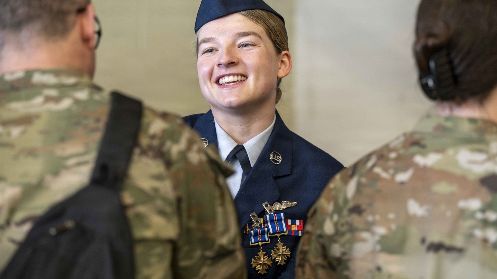 Team Fairchild Airmen congratulate U.S. Air Force Staff Sgt. Gabrielle Stallings, 93rd Air Refueling Squadron KC-135 Stratotanker boom operator, during a decoration ceremony at Fairchild Air Force Base, Washington, March 31, 2026. The receiving line following an official ceremony allows family, friends and supervisors to personally express their pride and congratulations for honorees. (U.S. Air Force photo by Airman 1st Class Emilee Seiler)
