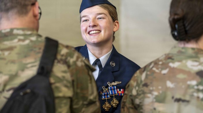 Team Fairchild Airmen congratulate U.S. Air Force Staff Sgt. Gabrielle Stallings, 93rd Air Refueling Squadron KC-135 Stratotanker boom operator, during a decoration ceremony at Fairchild Air Force Base, Washington, March 31, 2026. The receiving line following an official ceremony allows family, friends and supervisors to personally express their pride and congratulations for honorees. (U.S. Air Force photo by Airman 1st Class Emilee Seiler)