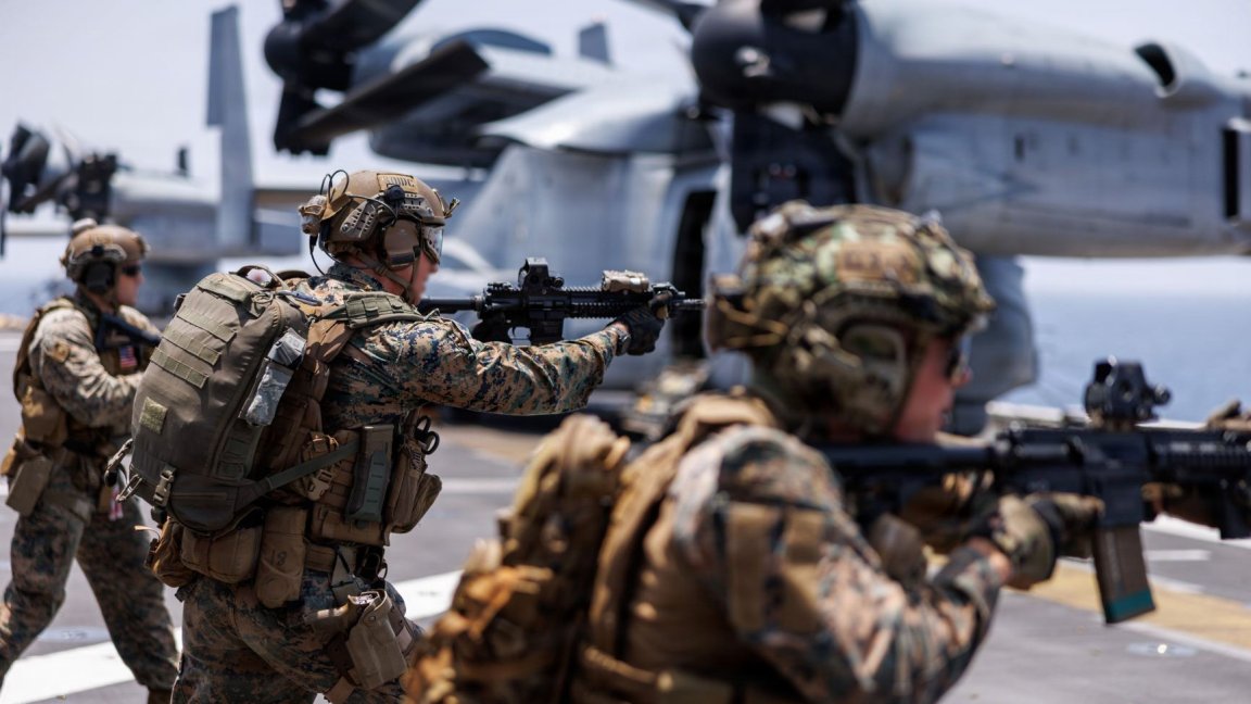 Image: U.S. Marines fire rifles during a deck shoot aboard the forward-deployed amphibious assault ship USS Tripoli (LHA 7), in the U.S. Central Command area of responsibility during Operation Epic Fury, April 2, 2026. (U.S. Marine Corps photo) 
