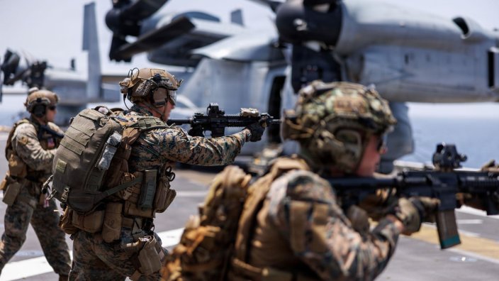 Image: U.S. Marines fire rifles during a deck shoot aboard the forward-deployed amphibious assault ship USS Tripoli (LHA 7), in the U.S. Central Command area of responsibility during Operation Epic Fury, April 2, 2026. (U.S. Marine Corps photo) 