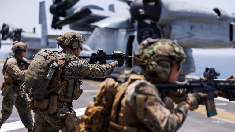 Image: U.S. Marines fire rifles during a deck shoot aboard the forward-deployed amphibious assault ship USS Tripoli (LHA 7), in the U.S. Central Command area of responsibility during Operation Epic Fury, April 2, 2026. (U.S. Marine Corps photo) 
