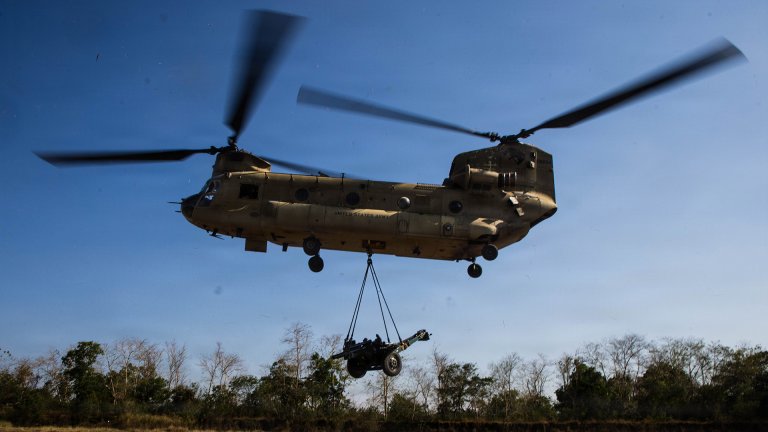 U.S. Army Soldiers assigned to 1st Battalion, 3rd Field Artillery Regiment, 25th Infantry Division Artillery, work with Philippine Army partners to sling load a Philippine Army M101 howitzer to a CH-47 Chinook during an air assault operation as part of Exercise Salaknib 2026 at Fort Magsaysay, Philippines, April 7, 2026. The training enhances the rapid deployment of artillery assets, increasing the combined readiness of the U.S.-Philippine Alliance. Salaknib is an annual exercise designed to enhance combat readiness and strengthen the U.S.-Philippine Alliance. (U.S. Army photo by Sgt. Taylor Gray)