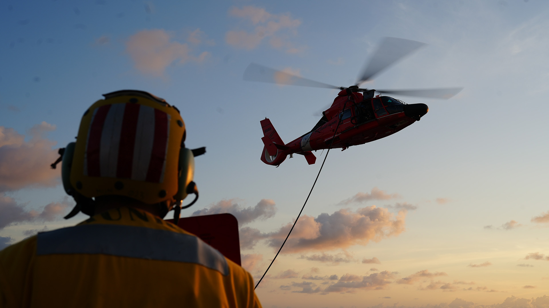 Ensign Jesse Johnson conducts a Helicopter In-Flight Refueling with the embarked U.S. Coast Guard’s Helicopter Interdiction Tactical Squadron (HITRON). The HITRON unit provided U.S. Coast Guard Cutter Munro (WMSL 755) with airborne use-of-force capabilities in the maritime law enforcement domain, directly supporting the successful interdiction of non-compliant vessels. (U.S. Coast Guard photo by L.t. j.g. Samika Lewis.)