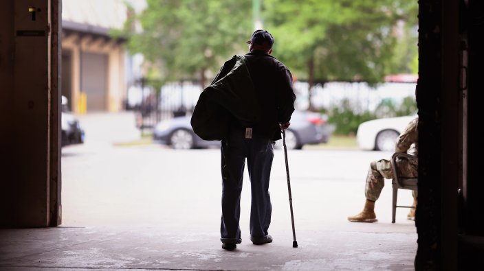 CHICAGO, ILLINOIS - JUNE 16: A military veteran leaves a Stand Down event designed to help veterans who are homeless or housing insecure on June 16, 2023 in Chicago, Illinois. The semi-annual event helps veterans who are experiencing homelessness connect with services to find them housing. The event also connects veterans with agencies to help with medical services, food, clothing, and also helps veterans navigate the VA benefits system. There are an estimated 500 homeless veterans in the Chicago area, and 38,000 nationwide. (Photo by Scott Olson/Getty Images)