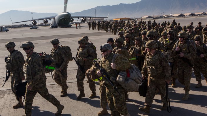BAGRAM AIR BASE, AFGHANISTAN - MAY 11: U.S. Army soldiers from the 101st Airborne Division march from the back of a C-17 cargo plane May 11, 2013 at Bagram Air Base, Afghanistan. After flying from their Division headquarters at Fort Campbell, Kentucky, the soldiers will deploy for 9 months replacing other U.S. Army units. U.S. soldiers and marines will maintain a presence inside Afghanistan until their planned withdrawal by the end of 2014. (Photo by Robert Nickelsberg/Getty Images)