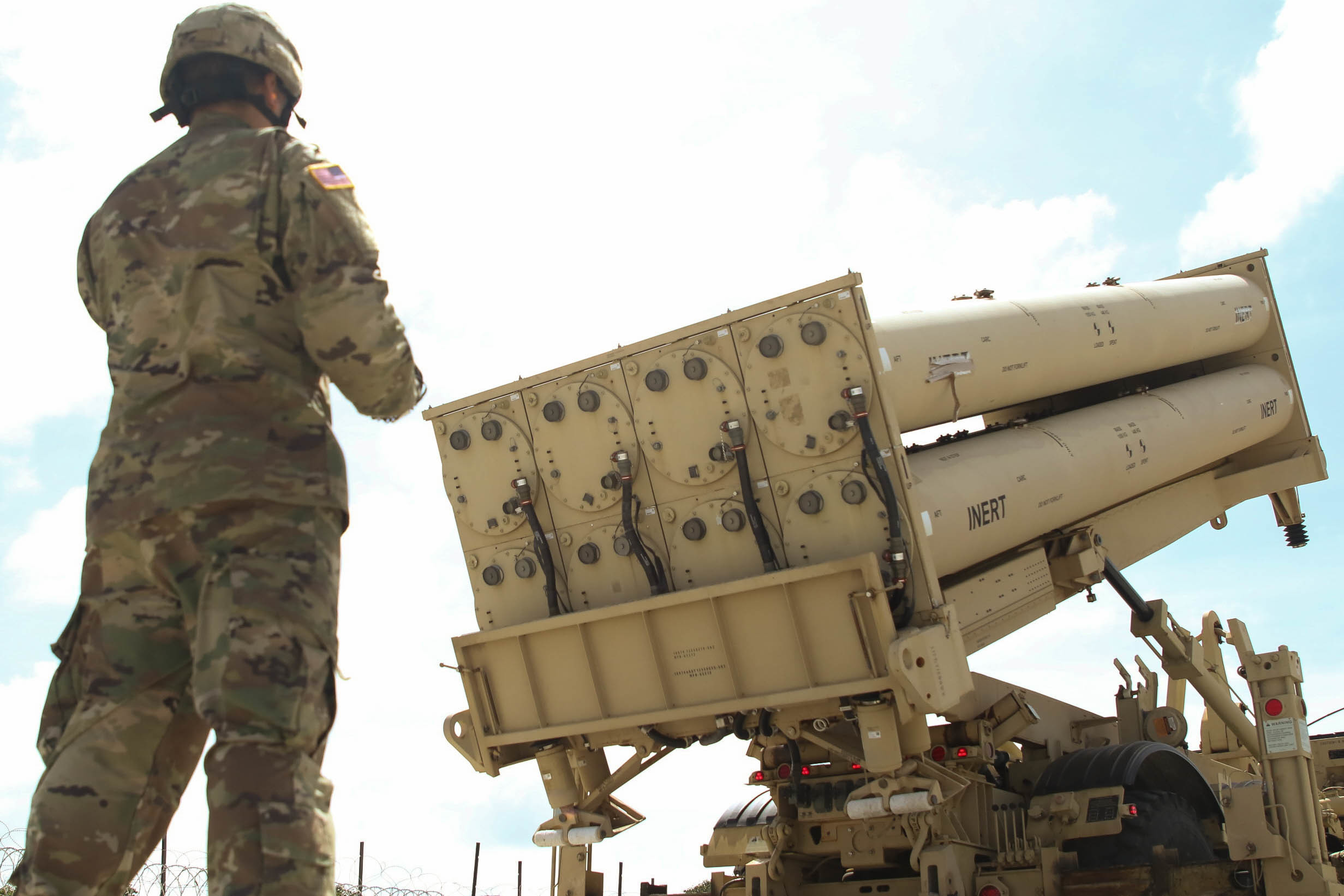 A Soldier with Task Force Talon, 94th Army Air and Missile Defense Command, observes as a missile pallet is lower, during a practice missile reload and unload drill of a Terminal High Altitude Area Defense (THAAD) system at Andersen Air Force Base, Guam, Feb. 6, 2019. (Army photo by Capt. Adan Cazarez)