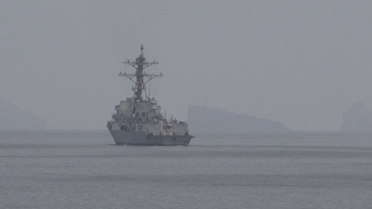 An American Navy destroyer sails through the Strait of Hormuz on April 11, 2026.