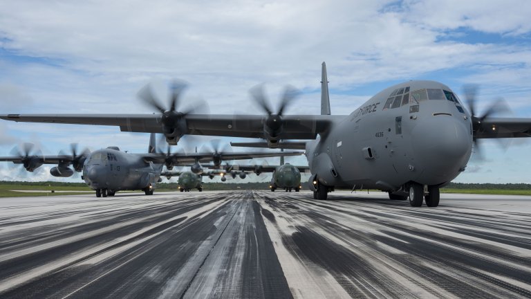 C-130 aircraft from the U.S., Japan, South Korea, and New Zealand prepare for takeoff on the runway at Andersen Air Force Base, Guam, on July 21, 2025. Air Force photo by Staff Sgt. Tyler McQuiston.