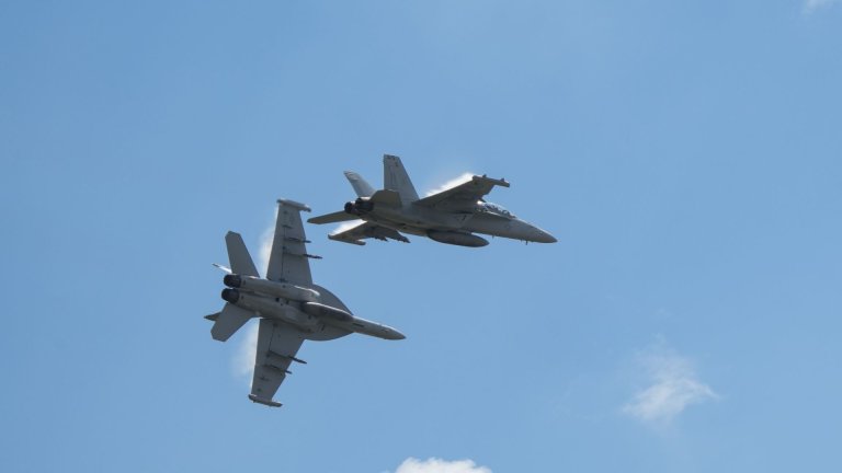 Navy EA-18G Growlers assigned to the Growler Demo Team perform at an airshow in August 2023. Air National Guard photo by Airman 1st Class Jeremiah Johnson.