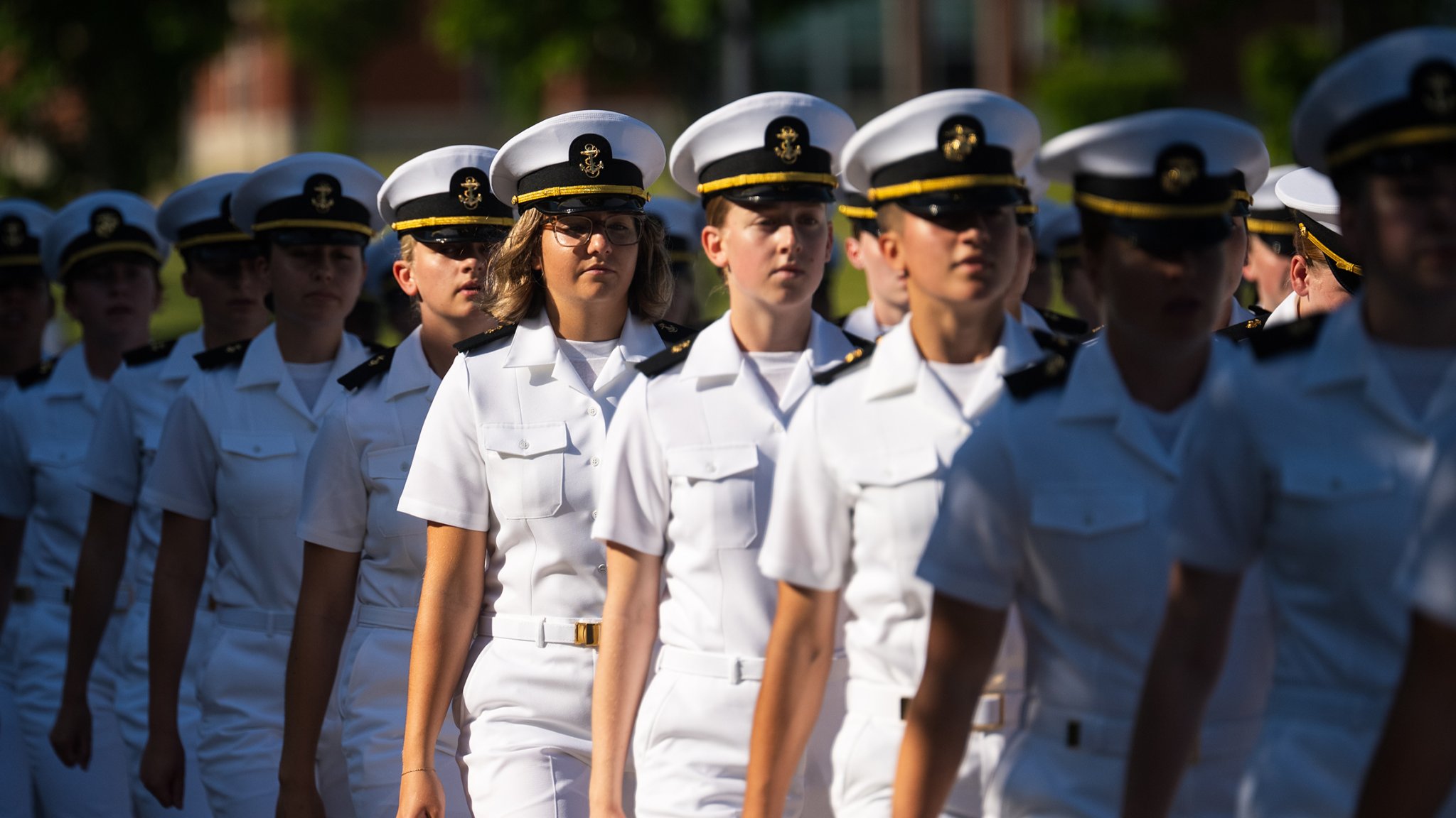 GREAT LAKES, Ill. (June 23, 2025) - Midshipman candidates from New Student Indoctrination (NSI) Cycle 1 march to their graduation ceremony at Midway Ceremonial Drill Hall at Recruit Training Command (RTC) aboard Naval Station Great Lakes, Illinois, June 23. NSI is a physically demanding 2.5-week course that provides standardized basic military instruction to Midshipman candidates and supports their transition into the Naval Reserve Officers Training Corps (NROTC). NROTC falls under Naval Service Training Command (NSTC), which is led by Rear Adm. Matthew Pottenburgh and headquartered aboard Naval Station Great Lakes, Illinois. NSTC oversees 98 percent of initial training for Navy enlisted and officer accessions, including RTC, Officer Training Command, and NROTC units at more than 160 colleges and universities. NSTC is also responsible for the Navy’s Citizen Development Program, which includes Navy National Defense Cadet Corps and Navy Junior Reserve Officers Training Corps units globally. (U.S. Navy photo by Mass Communication Specialist 1st Class Reymundo A. Villegas III)