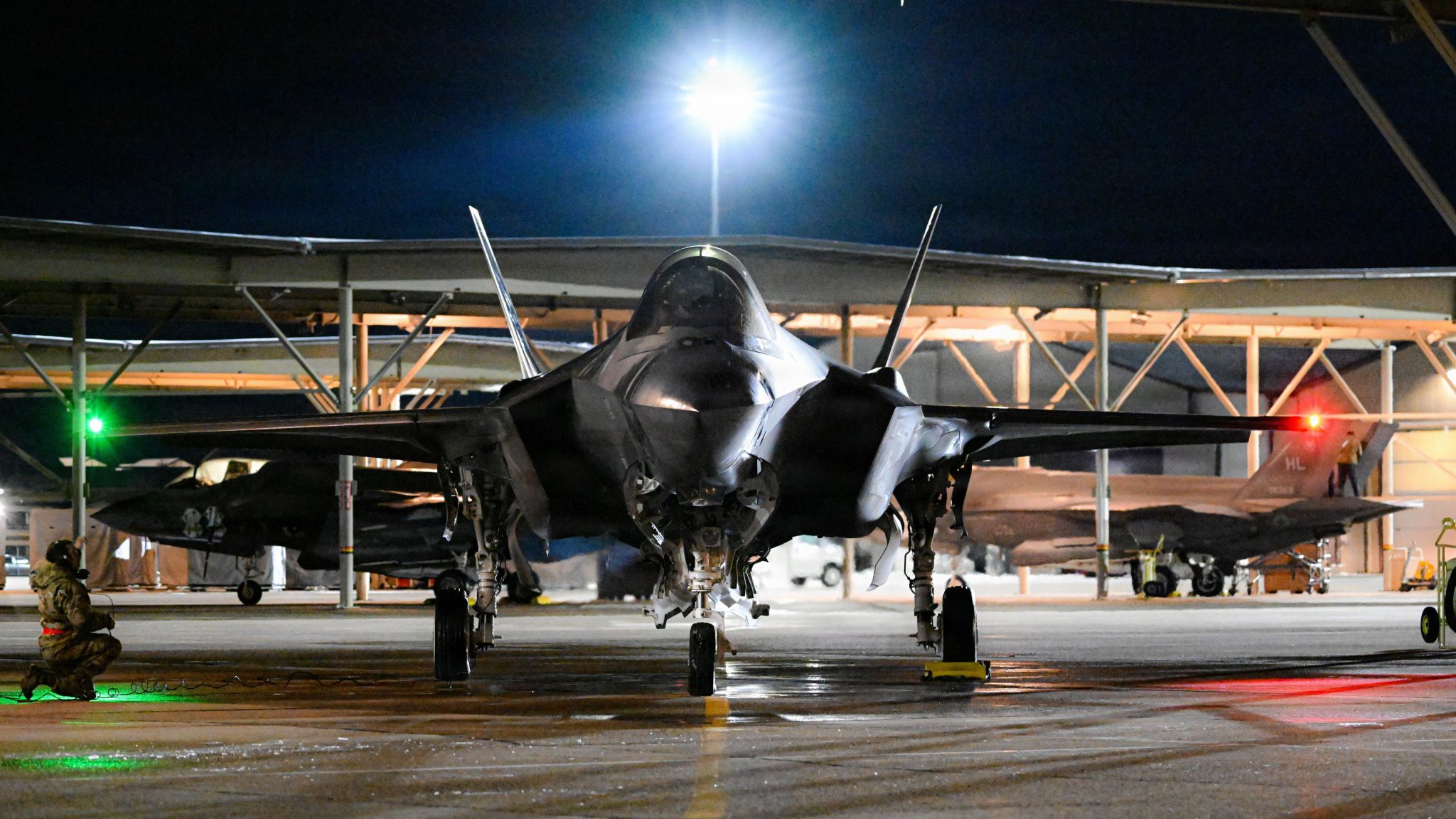 Featured Art: An F-35A Lightning II sits ready to taxi prior to a deployment from Hill Air Force Base, Utah, in March 2025. (United States Air Force photo by Capt. Nathan Poblete) 