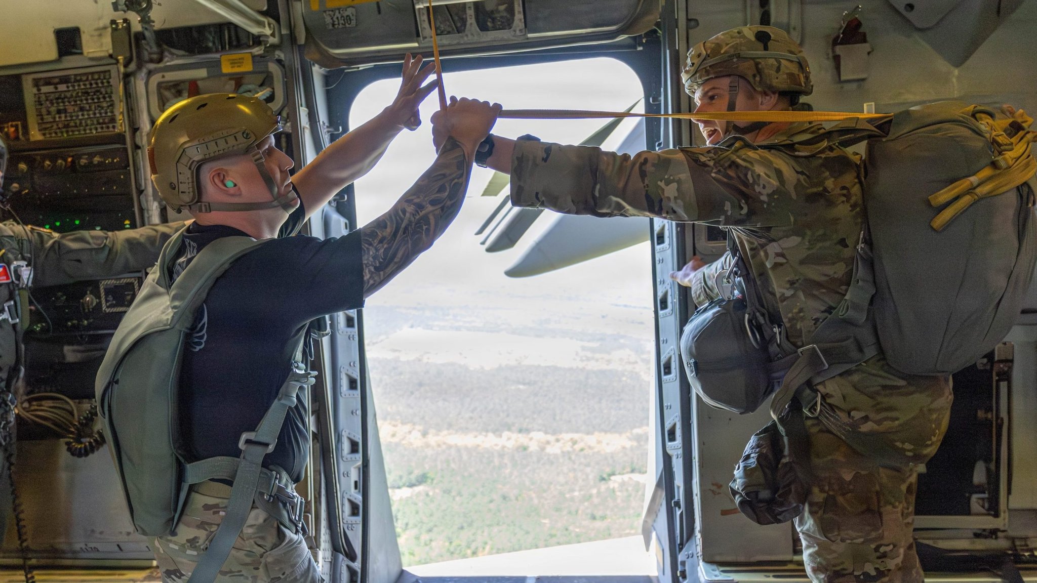 Jumpmaster teams complete the final phase of the 2026 Best Jumpmaster Competition, April 10, 2026, at Fort Benning, Georgia. The day's events tested advanced technical proficiency, including aircraft inspections, jumpmaster-to-aircrew briefings, and practical application exercises inside the aircraft. The competition culminated in a final jump onto Fryar Drop Zone, verifying the candidates' readiness to lead safe and effective airborne missions. (U.S. Army photo by Capt. Stephanie Snyder)