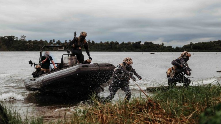 Nigerian Navy Special Boat Service operators exit a rigid-hull inflatable boat to conduct a ground raid during exercise Flintlock 26 in Côte d'Ivoire, April 29, 2026. Integrating multidomain capabilities served as a cornerstone of Flintlock 26, leveraging ground, maritime and air capabilities during planning and tactical operations to improve collective readiness. Since 2005, Flintlock has served as U.S. Africa Command’s premier annual special operations exercise. This year’s exercise brought together more than 30 countries across Côte d’Ivoire and Libya to build lethality and readiness, strengthen counterterrorism skills and increase collaboration across borders. (U.S. Army photo by Pfc. Kristina Randall) 