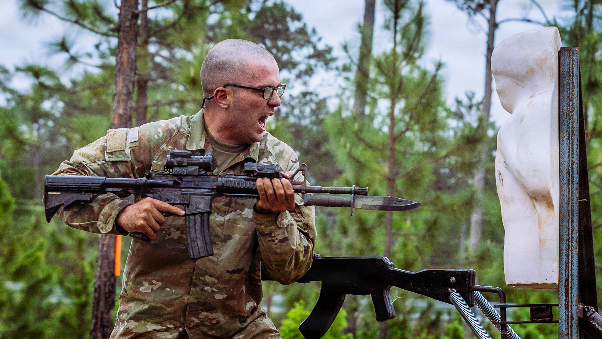 A U.S. Army Ranger Course student from Class 06-26 attacks an upright enemy target on the new Bayonet Assault Course during the Ranger Assessment Phase (RAP) April 21, 2026, at Fort Benning, Georgia. The quarter-mile course is a recent addition to the Malvesti Obstacle Course and was designed to rapidly instill grit and violence of action, preparing Rangers to close with and destroy the enemy in contested environments where modern technology may fail. (U.S. Army photo by Joey Rhodes II)