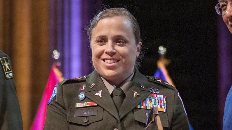 Maj. (Dr.) Erika Page receives the Hero of Military Medicine Award from Brig. Gen. Lance Raney (left), U.S. Army deputy surgeon general, and Joseph Caravalho, president and chief executive officer of the Henry M. Jackson Foundation for the Advancement of Military Medicine, May 7 at the Washington National Cathedral in Washington, D.C. The annual Heroes of Military Medicine awards recognize outstanding contributions by senior leaders, medical professionals, and civilians working in the Department of War.